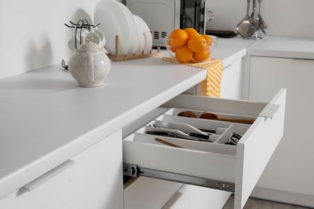 Soft close drawer runner in a kitchen drawer Soft close drawer runner in a kitchen drawer
